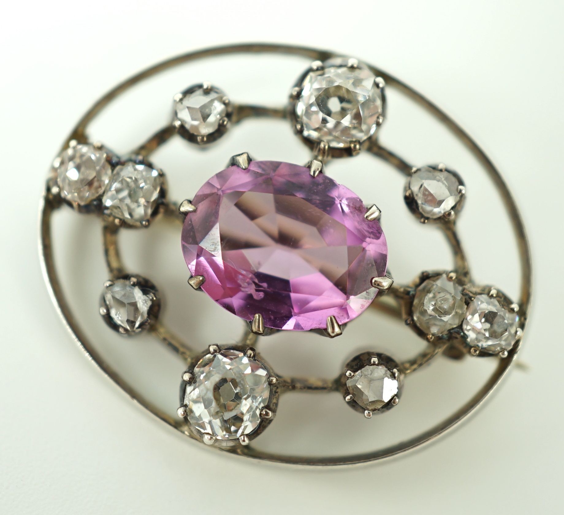 A 19th century gold and silver, pink topaz and diamond set openwork oval brooch